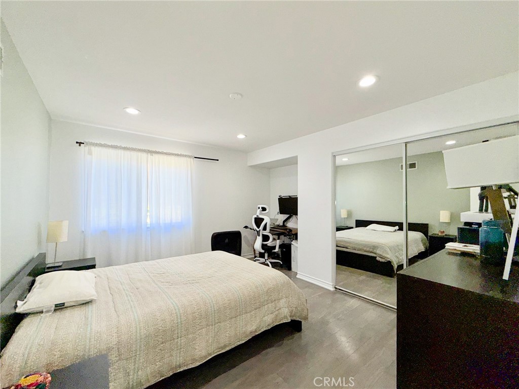 25714 Wallace Place Stevenson Ranch, CA 91381 - Photo 17 of 24 a bedroom with bed and a couch