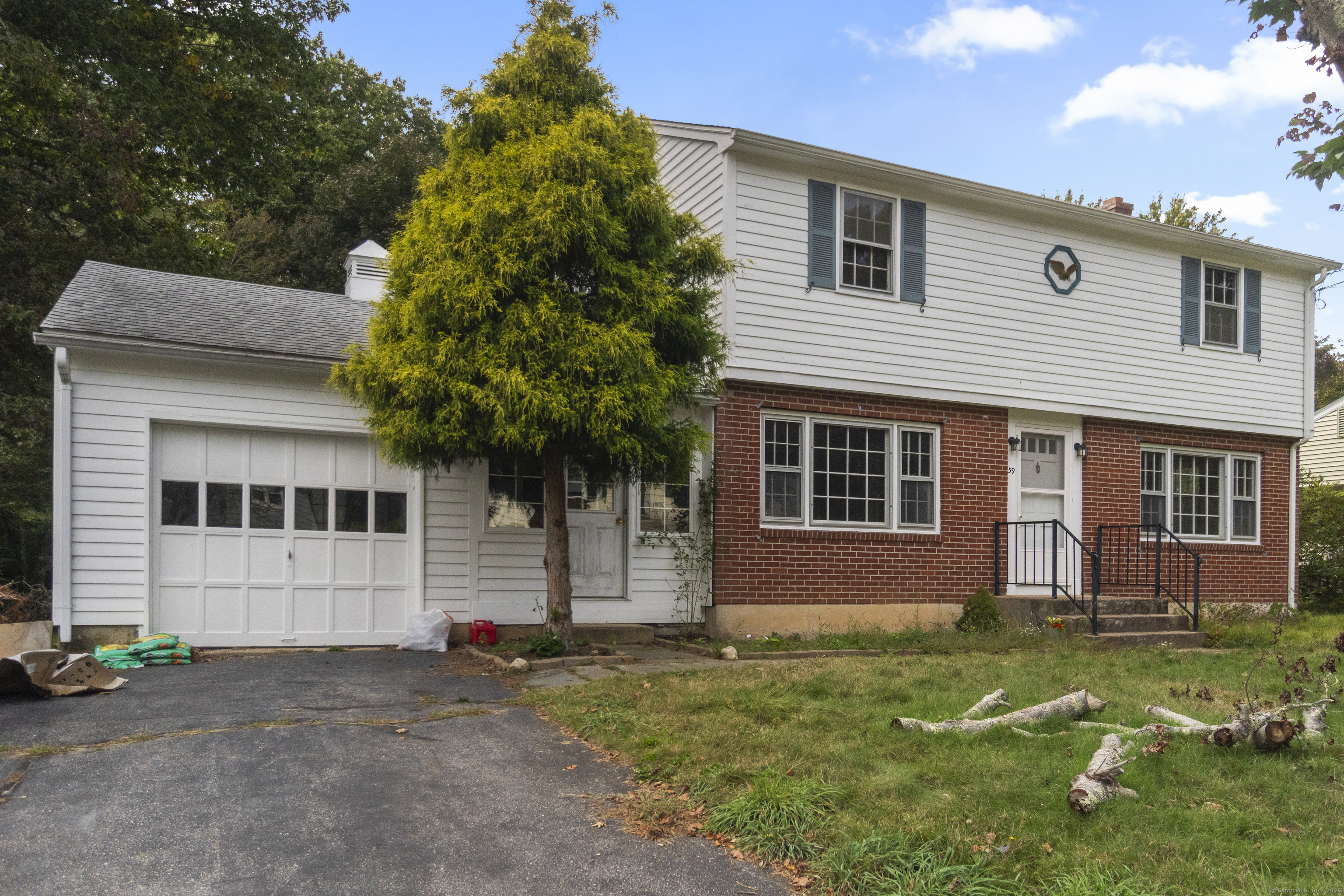 59 Noank Ledyard Road Groton, CT 06355 - Photo 1 of 1 a front view of a house with garden
