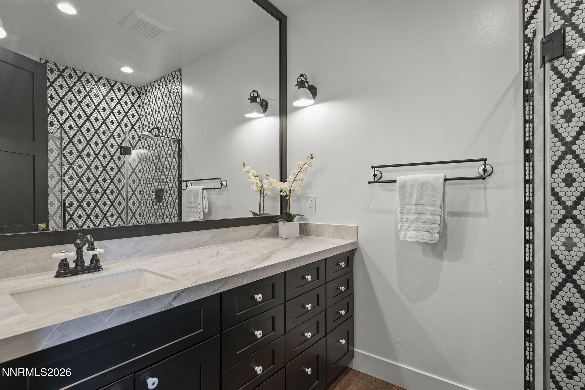 1426 Foothill Road Reno, NV 89511 - Photo 38 of 100 a bathroom with a double vanity sink and mirror