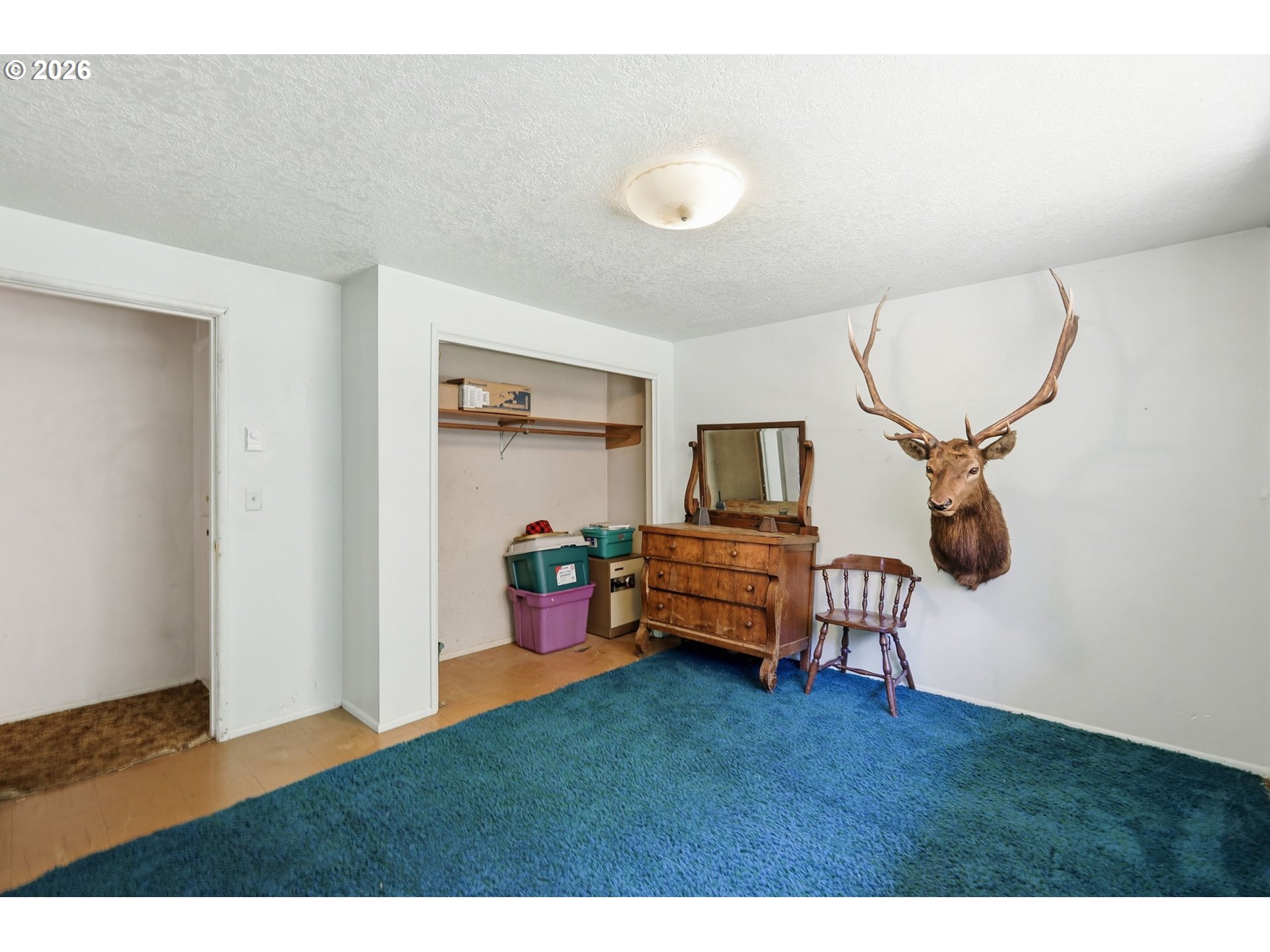49782 Huckleberry Road Oakridge, OR 97463 - Photo 20 of 21 a bedroom with furniture and a window