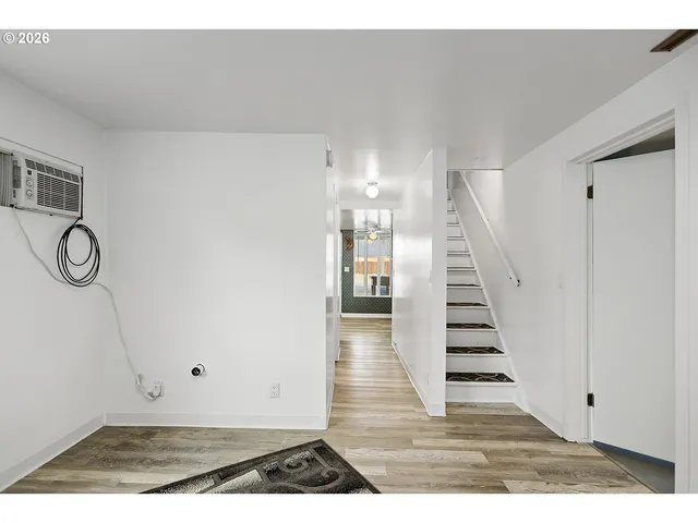 a view of entryway with wooden floor