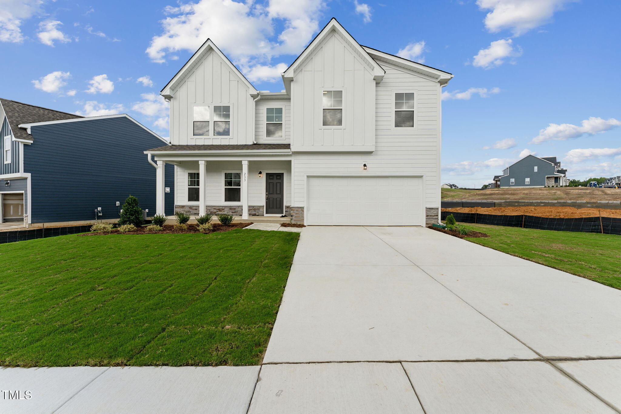 72 Cribbs Lane Middlesex, NC 27557 - Photo 6 of 45 a front view of a house with a garden and plants