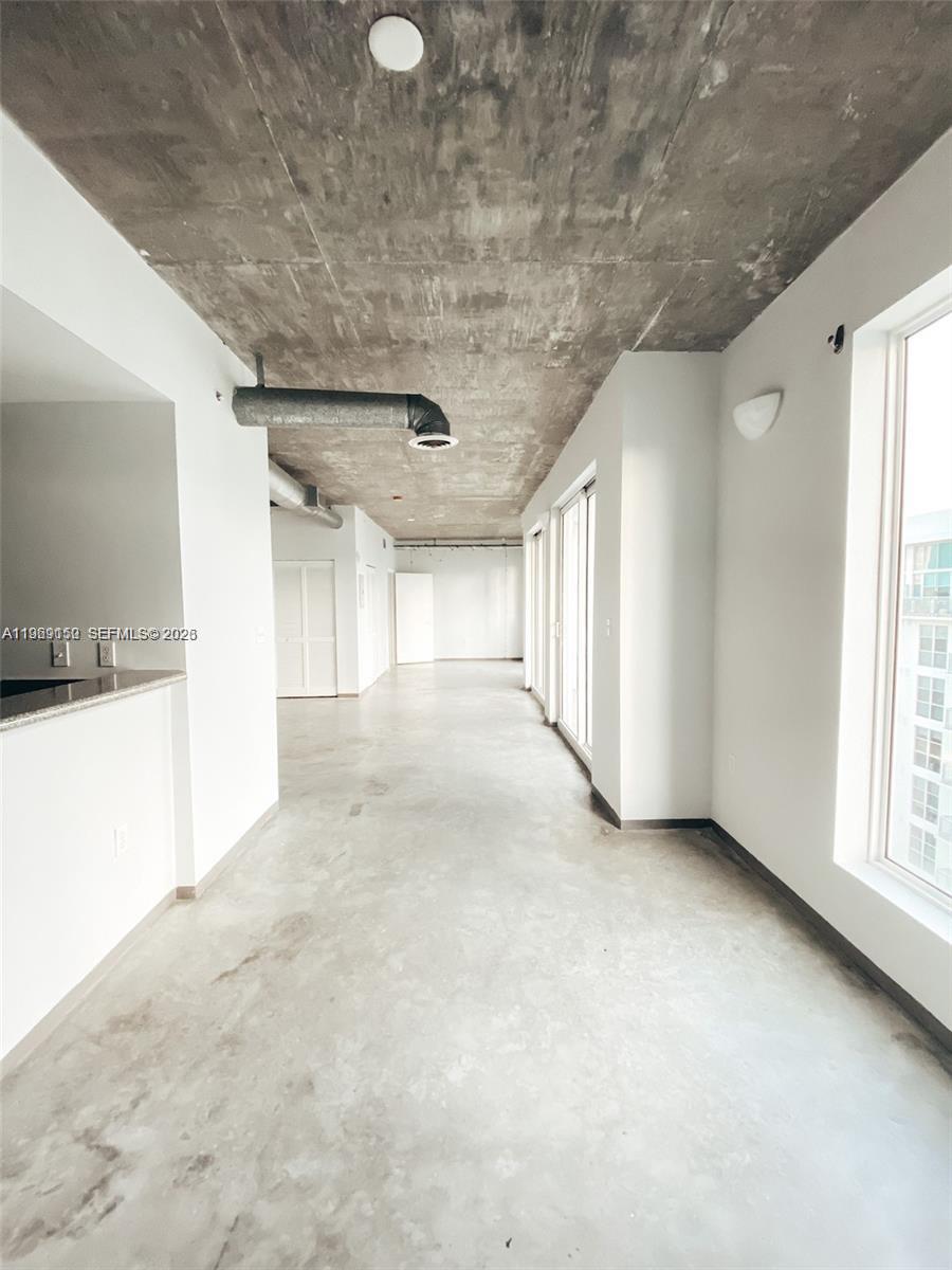 455 Northeast 25th Street, Unit 809 Miami, FL 33137 - Photo 15 of 18 a view of a livingroom with an empty space