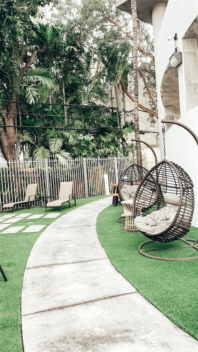 455 Northeast 25th Street, Unit 809 Miami, FL 33137 - Photo 17 of 18 a view of a backyard with wooden fence