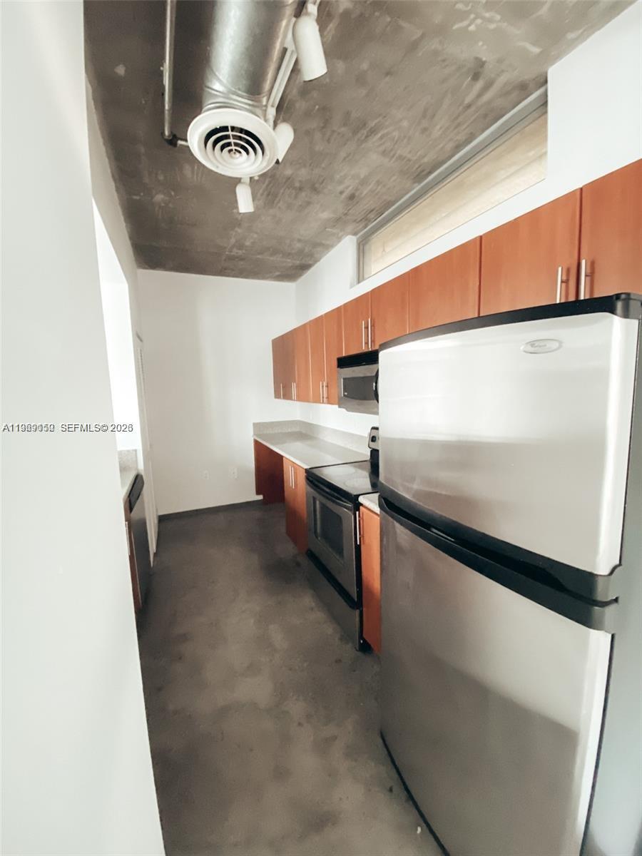 455 Northeast 25th Street, Unit 809 Miami, FL 33137 - Photo 8 of 18 a utility room with dryer and washer