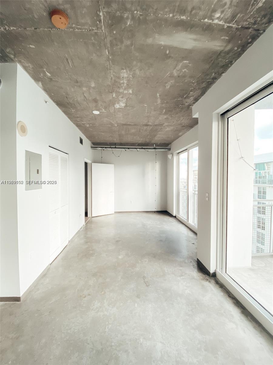 455 Northeast 25th Street, Unit 809 Miami, FL 33137 - Photo 10 of 18 a view of an empty room with a window