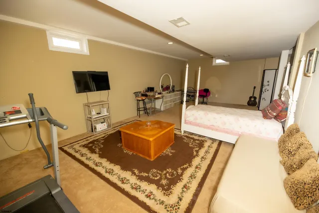 a room with wooden floor and furniture