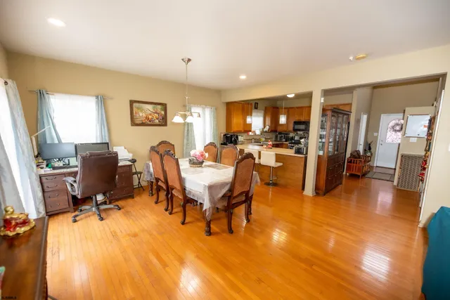 a view of a livingroom with furniture and a flat screen tv