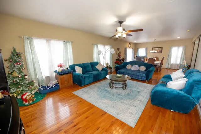 a living room with furniture and flowers