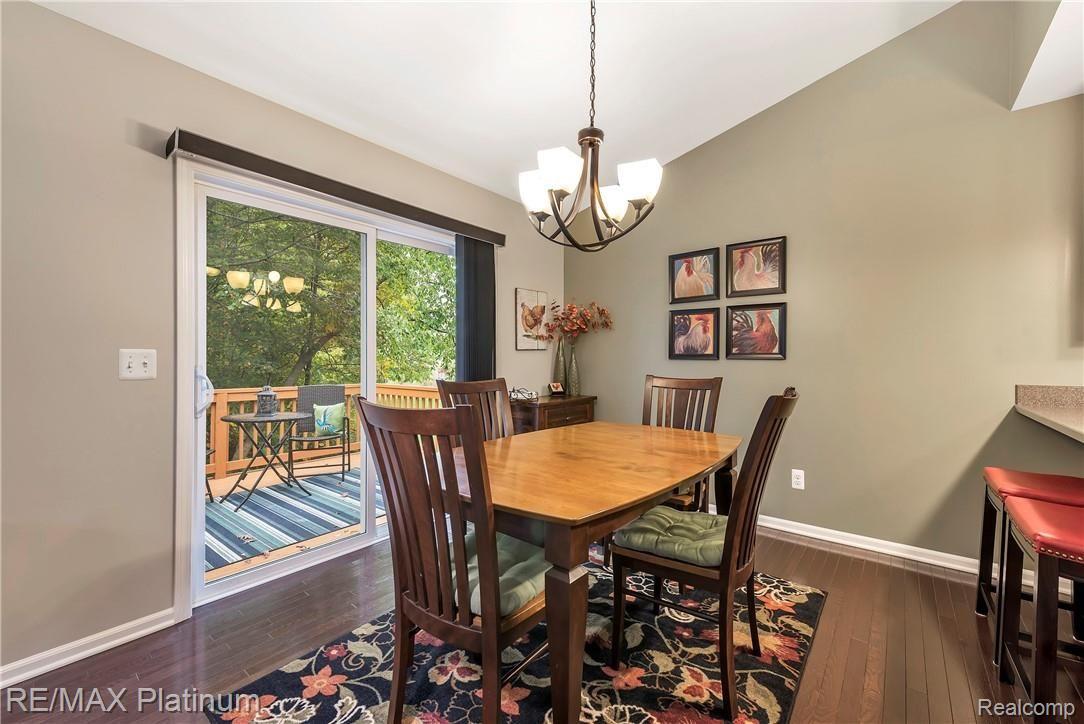 1013 Yarrow Howell, MI 48843 - Photo 9 of 35 Dining Room with Hardwood Floors & View of Woods