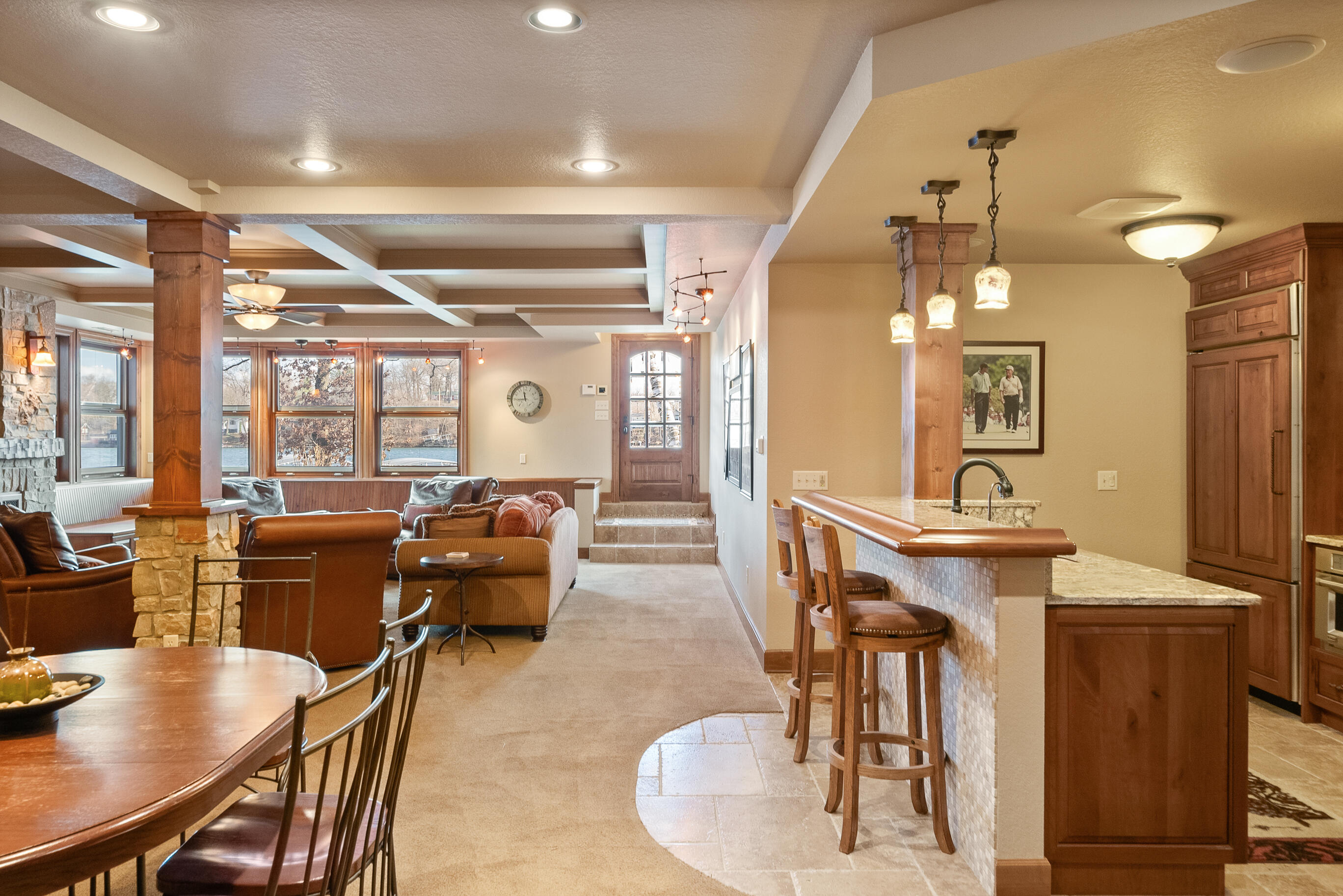 W5539 Oak Park Road La Grange, WI 53121 - Photo 46 of 49 Lower level bar and kitchen area with open floor plan to living and rec space