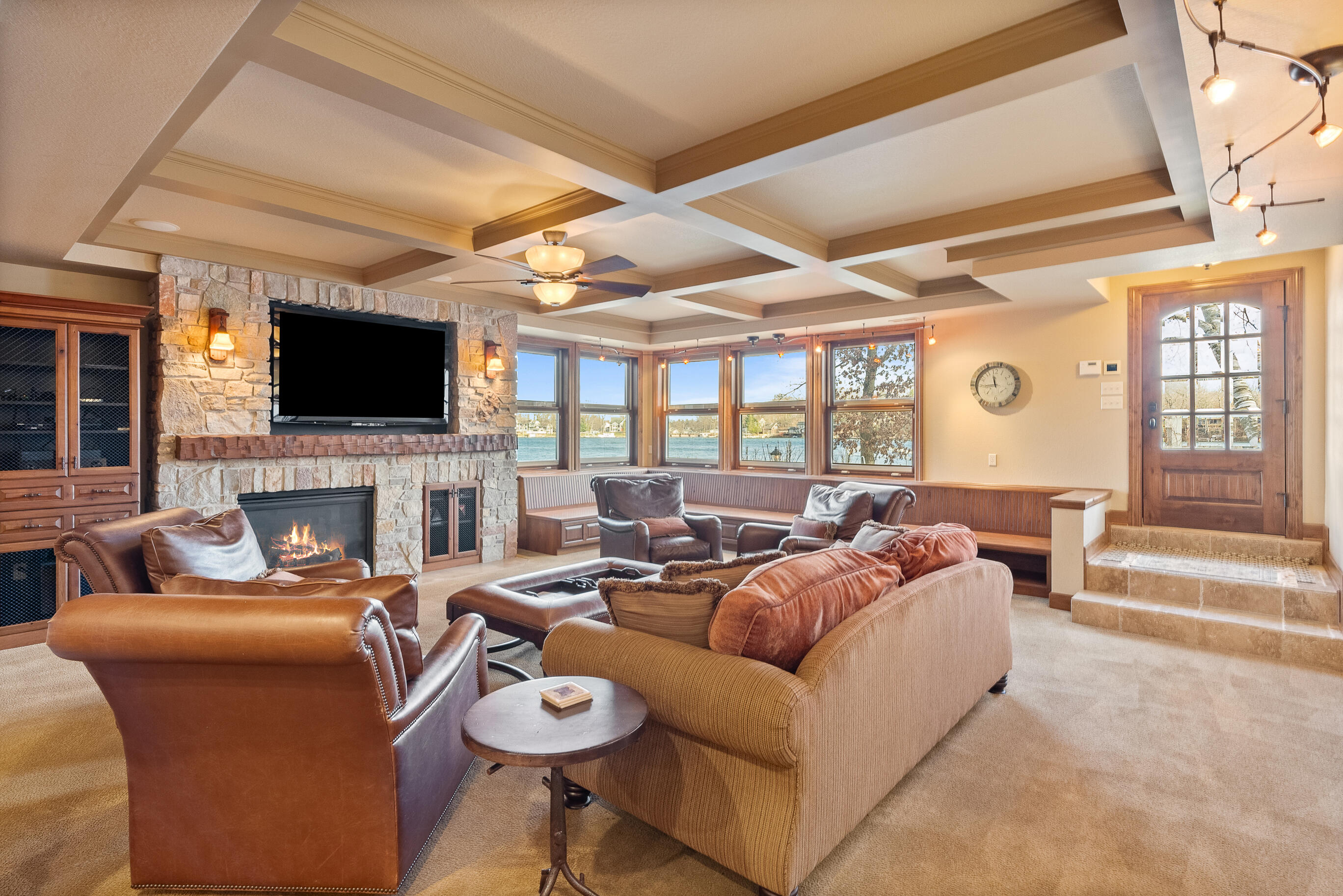 W5539 Oak Park Road La Grange, WI 53121 - Photo 22 of 49 Fireplace in walk out lower level living room with views of the lake