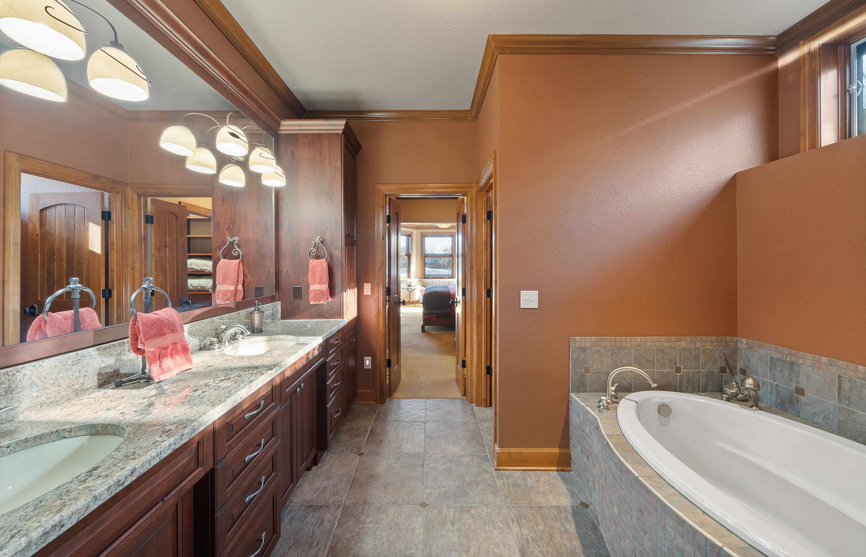 W5539 Oak Park Road La Grange, WI 53121 - Photo 25 of 46 Jacuzzi tube with granite and cherry cabinetry adorn the baths