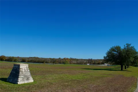 a view of a lake in a yard