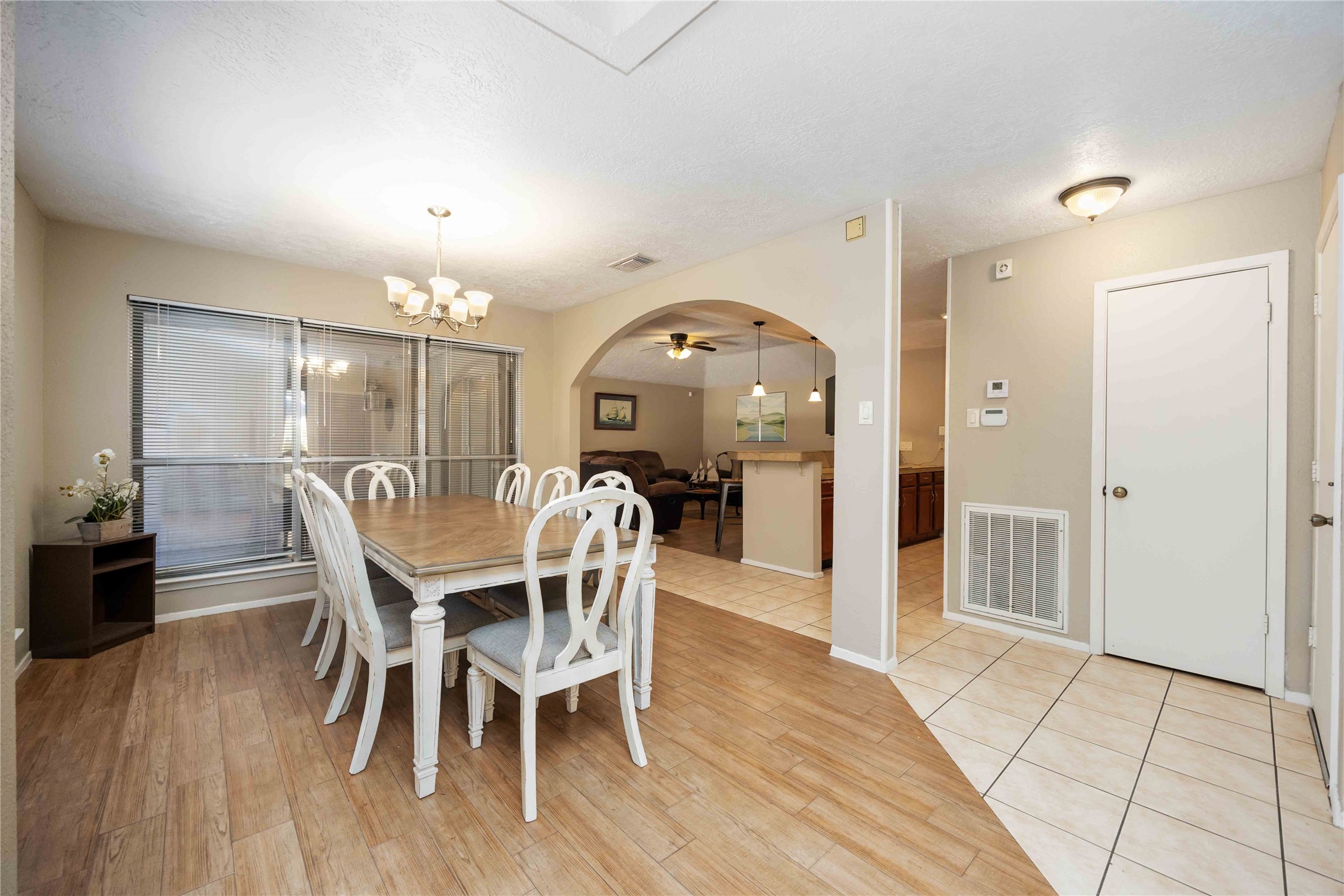 2423 Prides Crossing Road Houston, TX 77067 - Photo 11 of 27 a view of a dining room with furniture and wooden floor