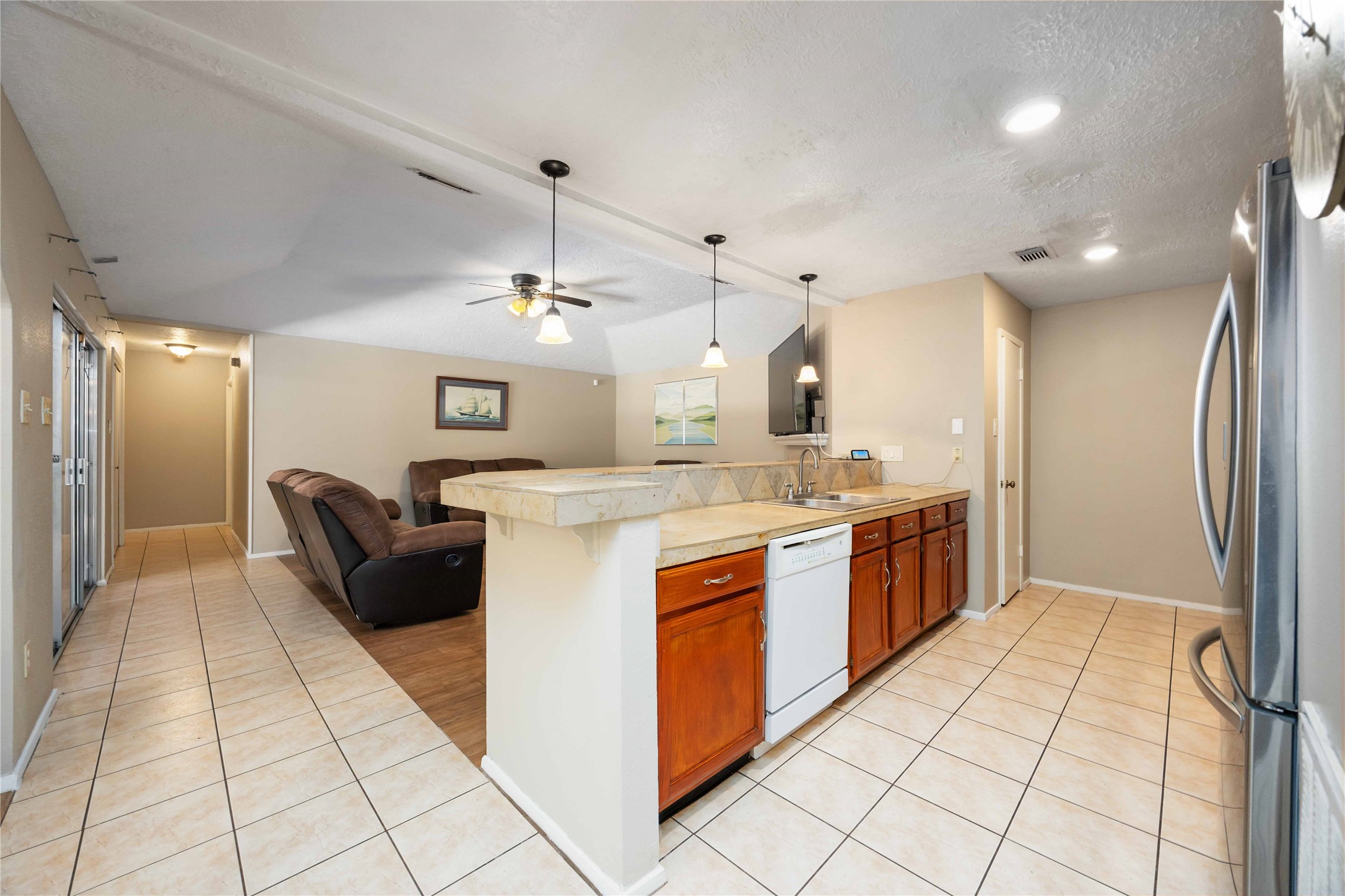 2423 Prides Crossing Road Houston, TX 77067 - Photo 12 of 27 a large kitchen with stainless steel appliances kitchen island granite countertop a large counter top and cabinets