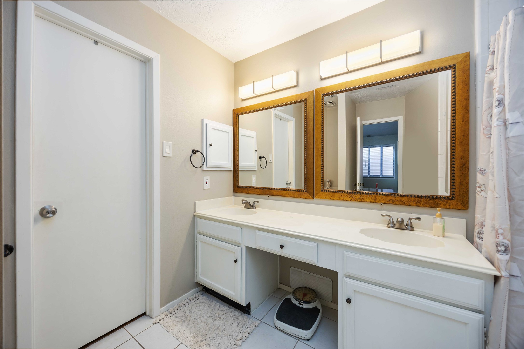2423 Prides Crossing Road Houston, TX 77067 - Photo 15 of 27 a bathroom with a sink and a mirror