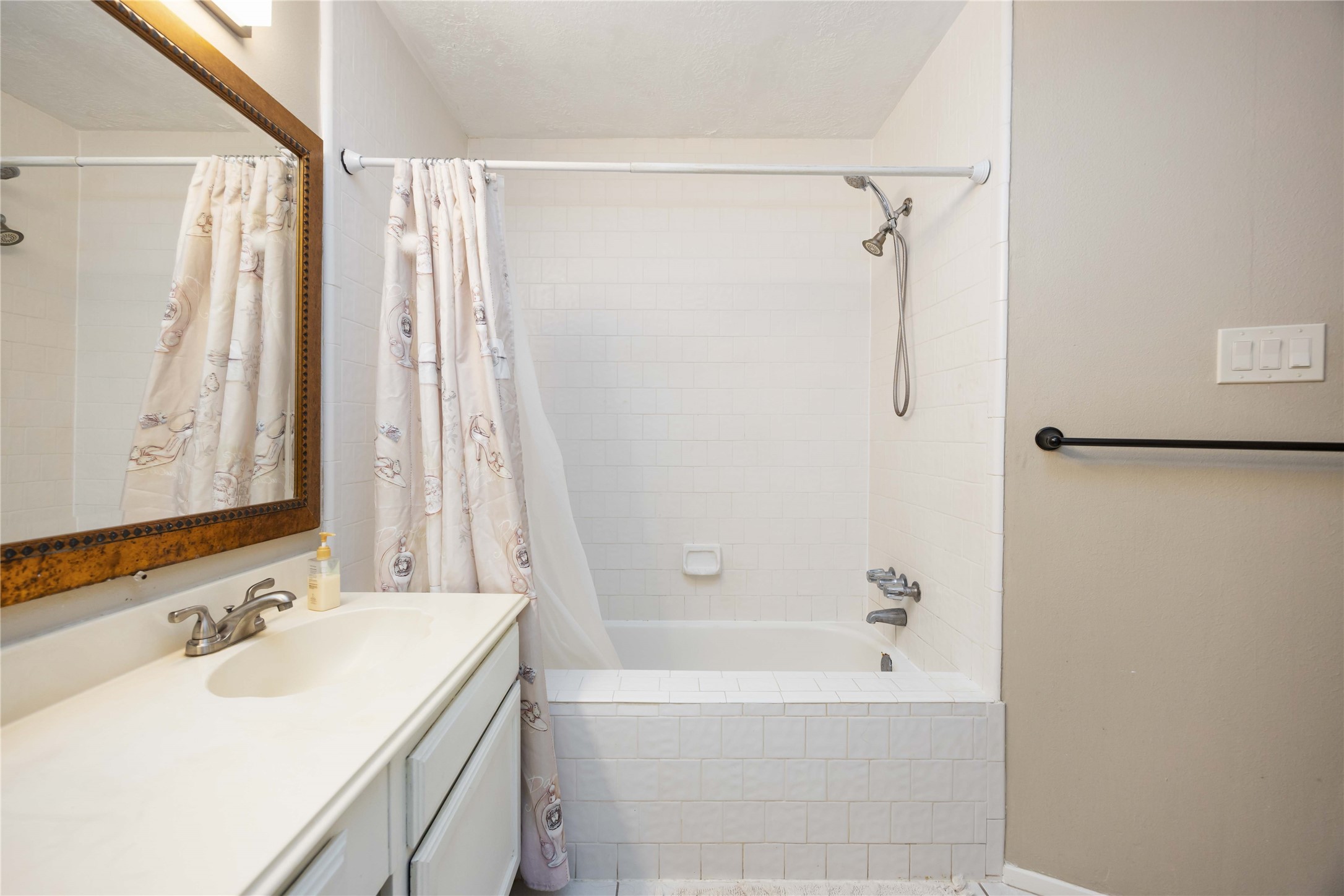2423 Prides Crossing Road Houston, TX 77067 - Photo 16 of 27 a bathroom with a sink double vanity mirror and a bathtub