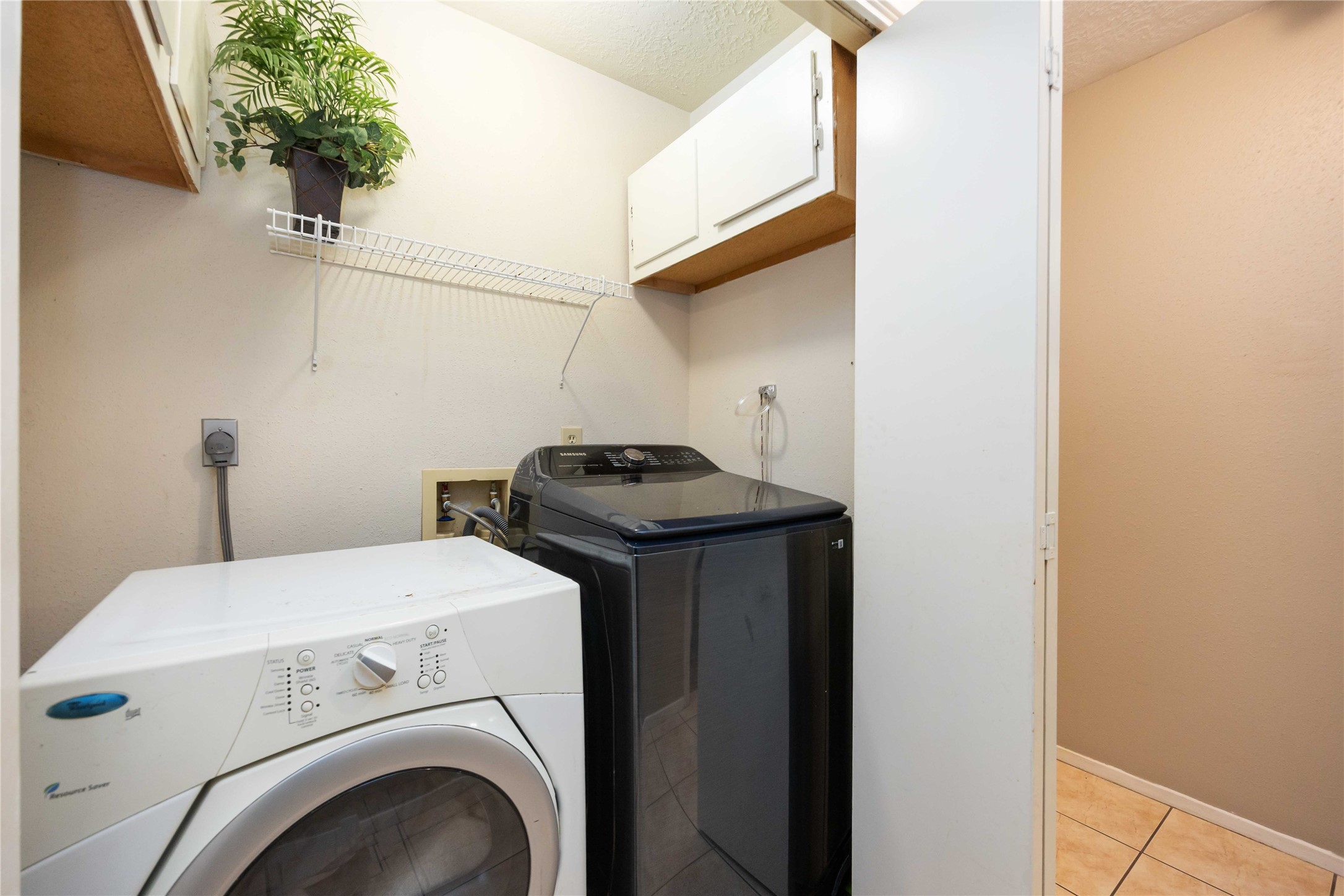 2423 Prides Crossing Road Houston, TX 77067 - Photo 20 of 27 a utility room with dryer and washer