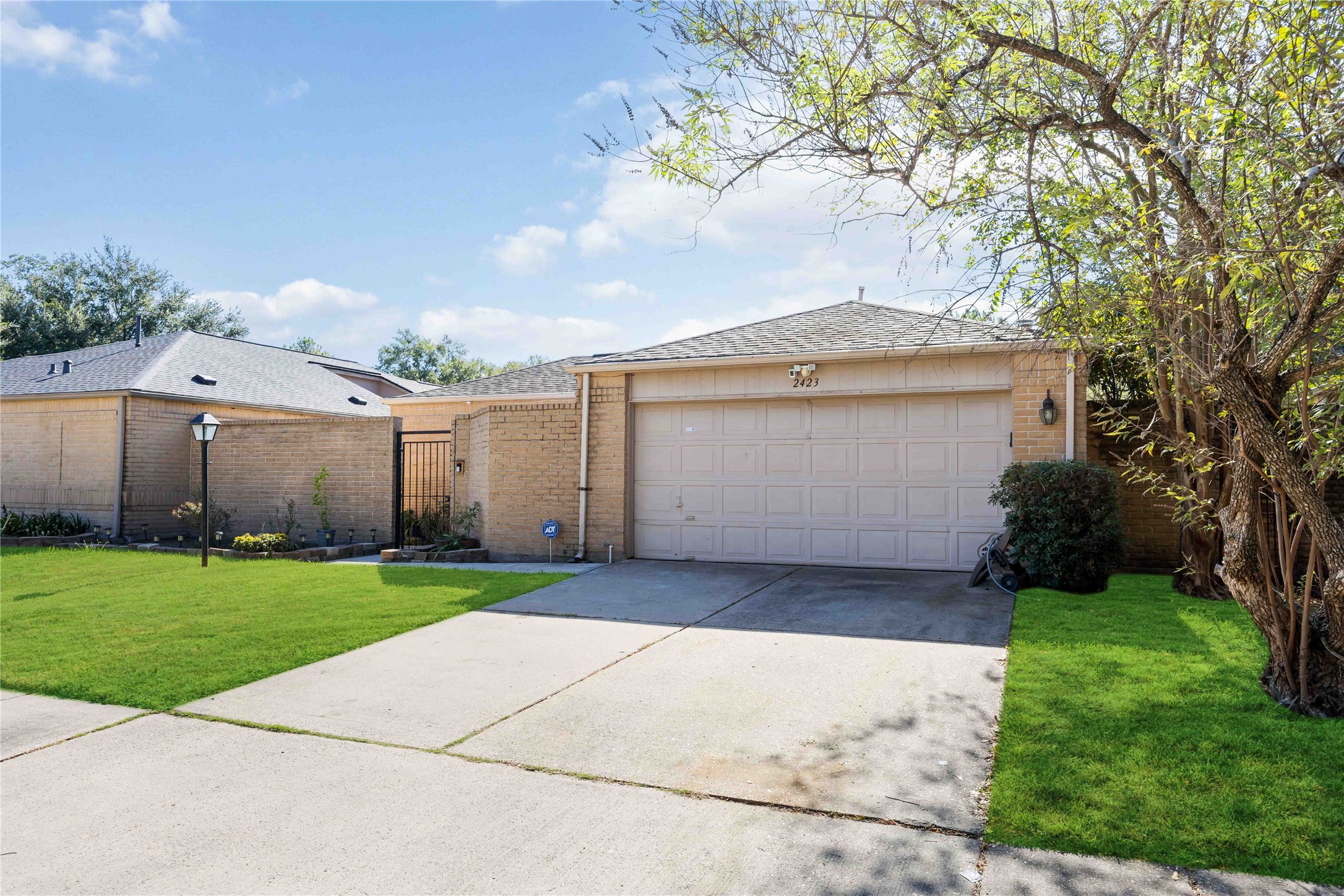 2423 Prides Crossing Road Houston, TX 77067 - Photo 2 of 27 a view of a house with a yard and potted plants