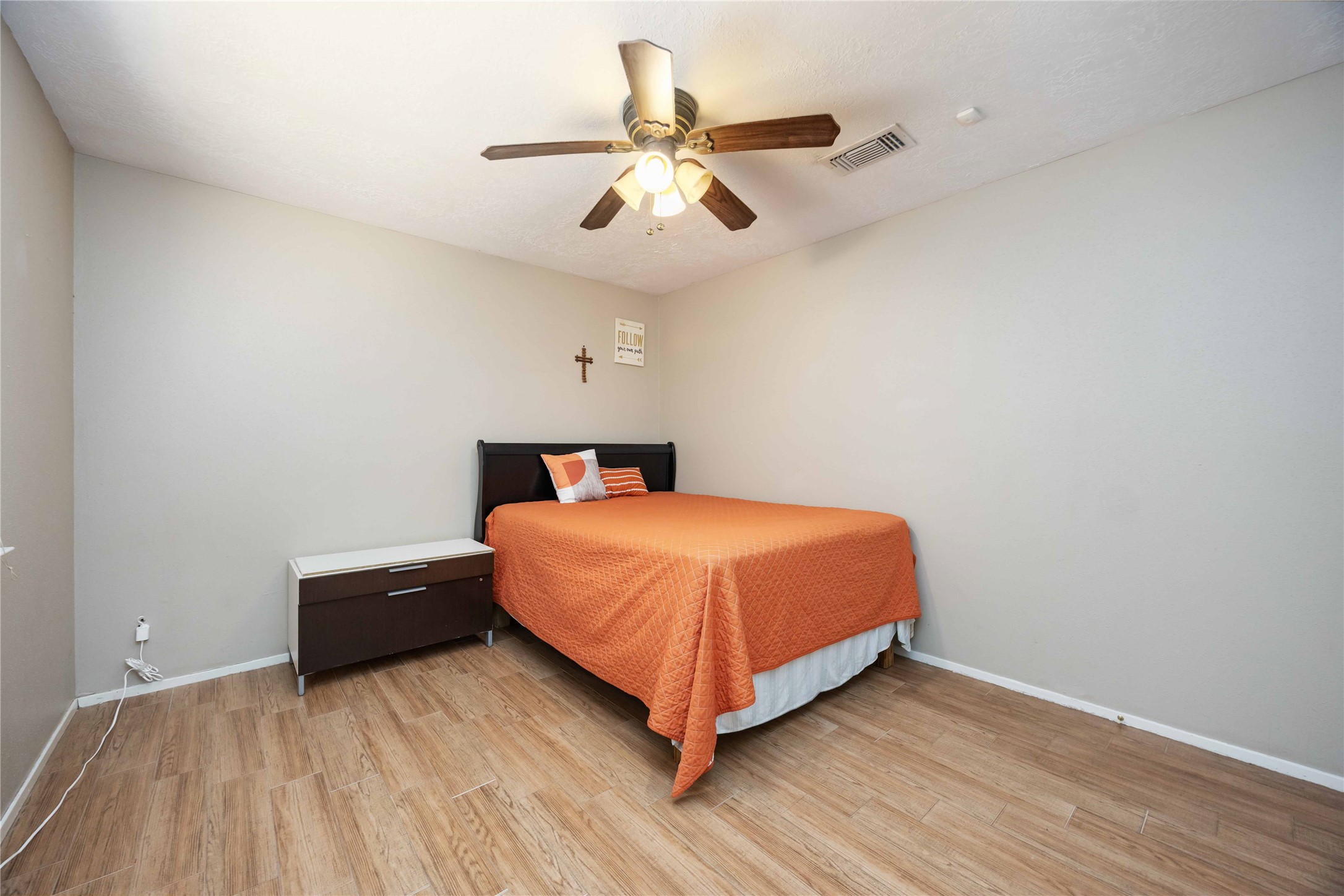2423 Prides Crossing Road Houston, TX 77067 - Photo 22 of 27 a bed room with a bed and a ceiling fan