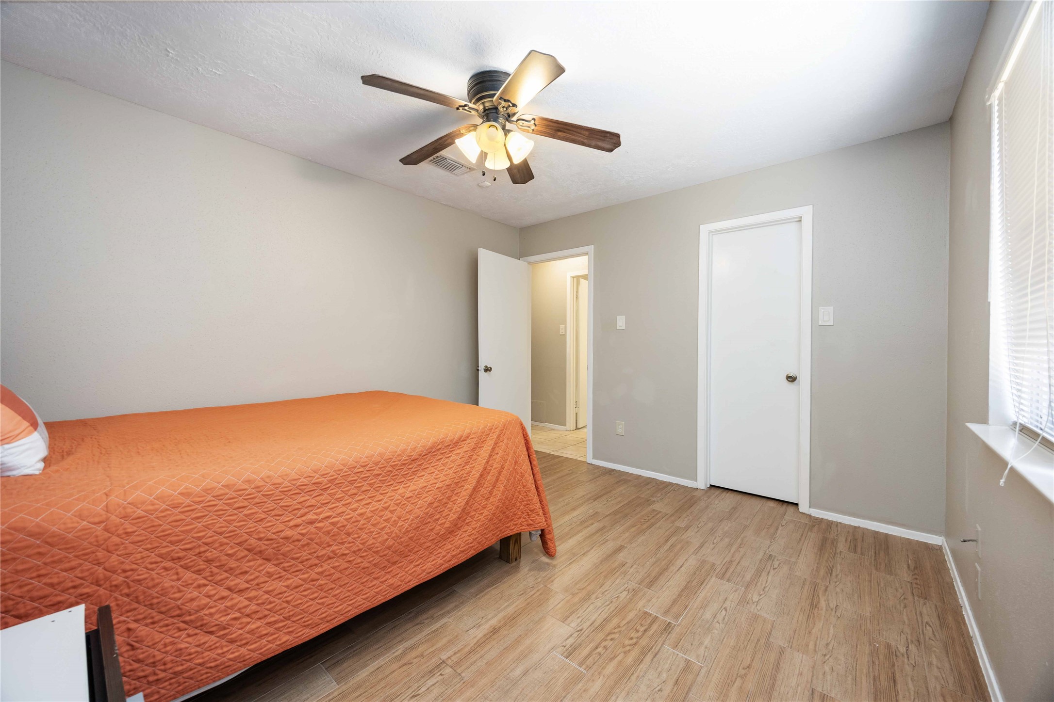 2423 Prides Crossing Road Houston, TX 77067 - Photo 23 of 27 a bedroom with bed and window