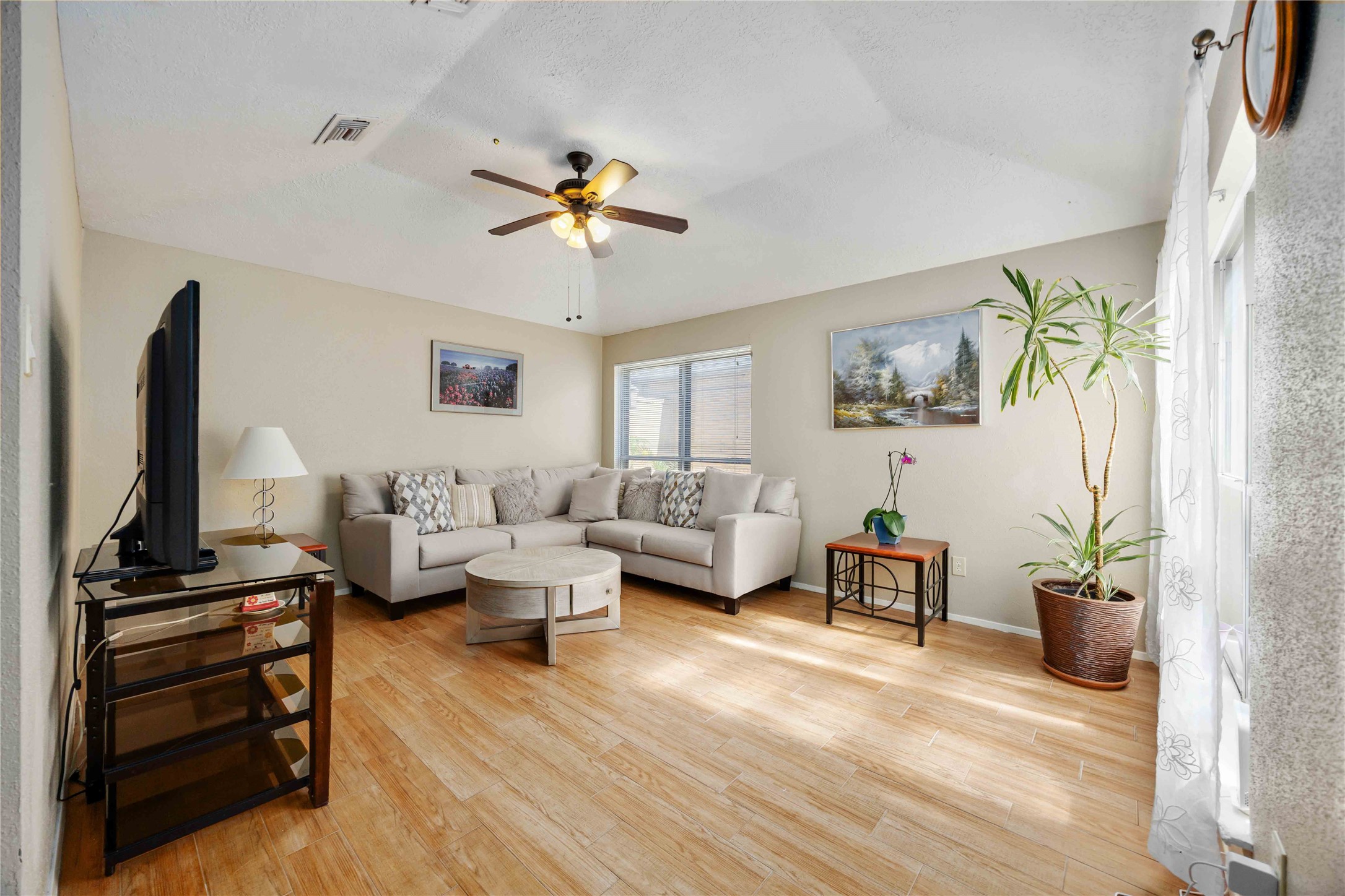 2423 Prides Crossing Road Houston, TX 77067 - Photo 5 of 27 a living room with furniture and a flat screen tv