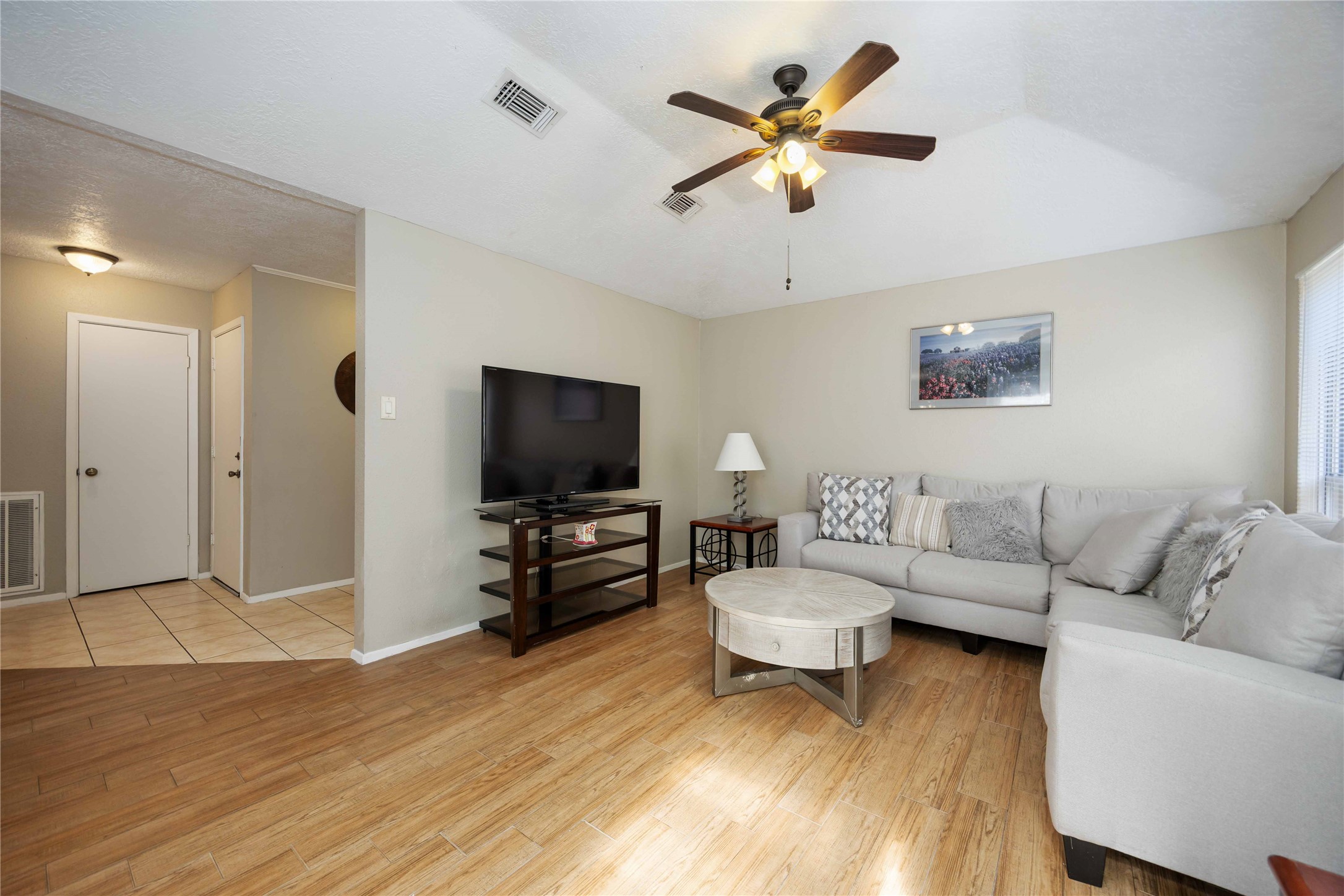 2423 Prides Crossing Road Houston, TX 77067 - Photo 6 of 27 a living room with furniture and a flat screen tv