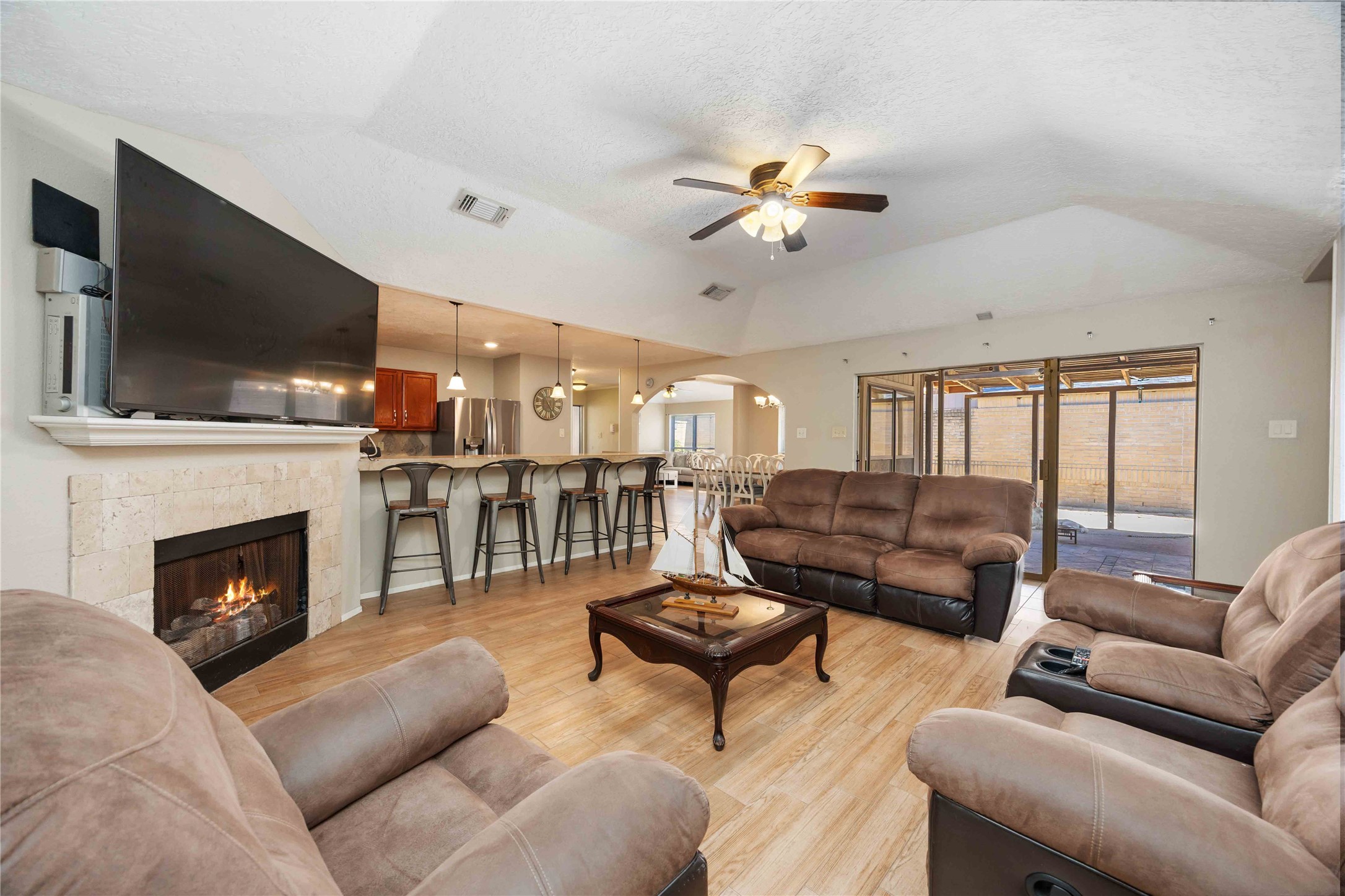2423 Prides Crossing Road Houston, TX 77067 - Photo 9 of 27 a living room with furniture fireplace and flat screen tv