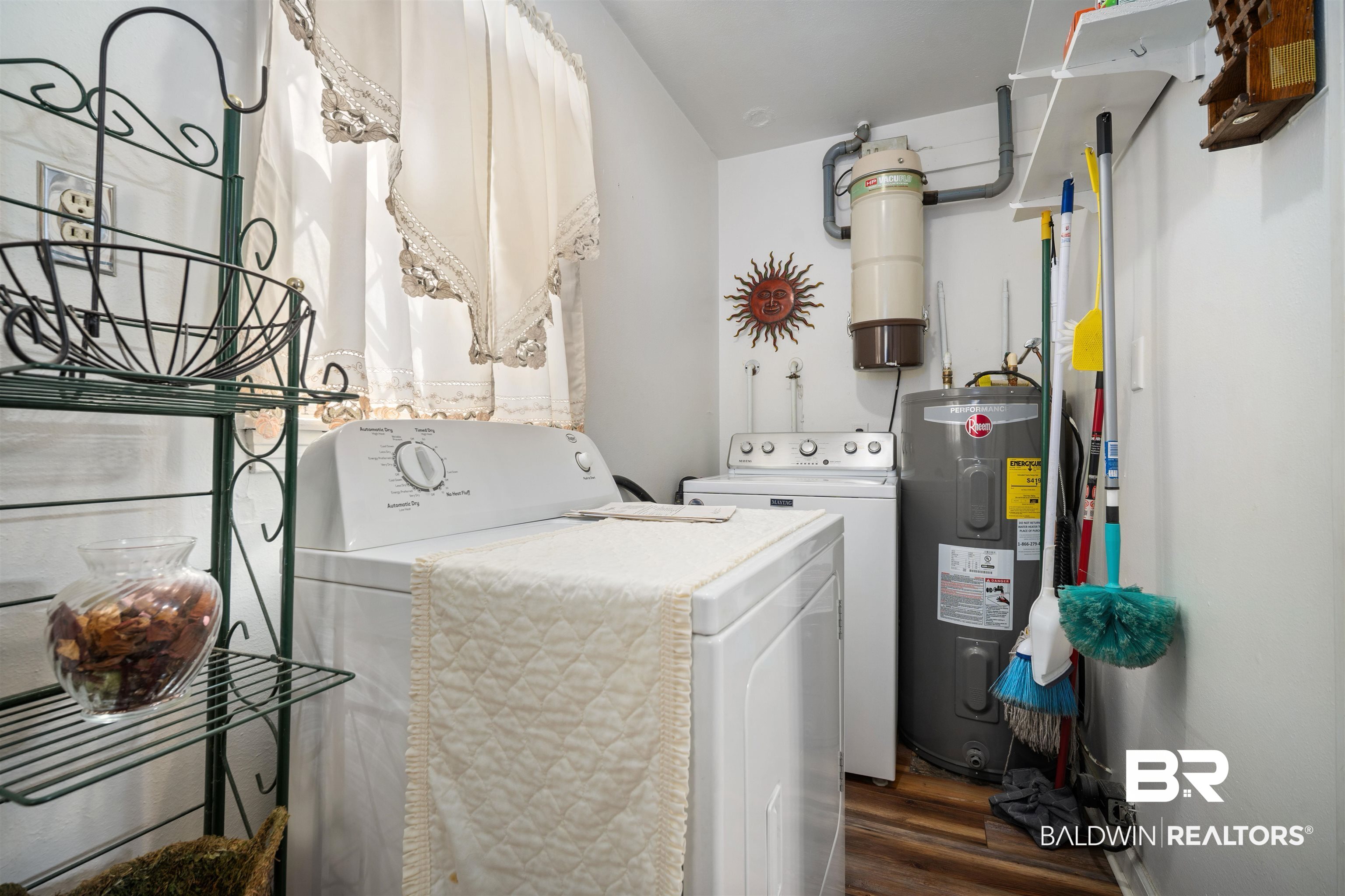 2618 Serigny Drive Mobile, AL 36605 - Photo 12 of 25 Laundry room with electric water heater, washer and clothes dryer, and dark wood-style flooring