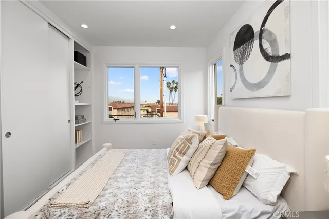 a bedroom with bed and a window