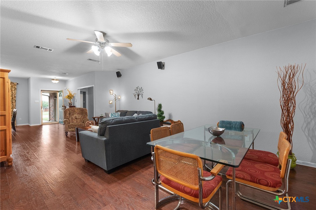 812 Taylor Creek Road Copperas Cove, TX 76522 - Photo 14 of 44 a living room with furniture and a chandelier