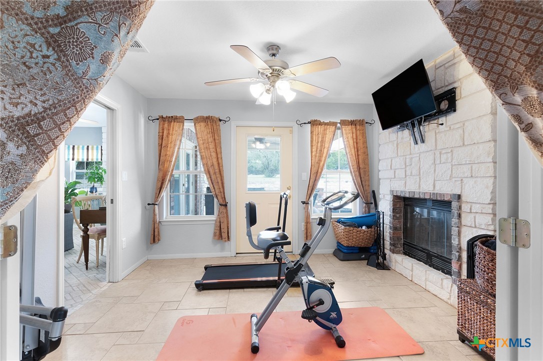 812 Taylor Creek Road Copperas Cove, TX 76522 - Photo 20 of 44 a living room with furniture fireplace and flat screen tv