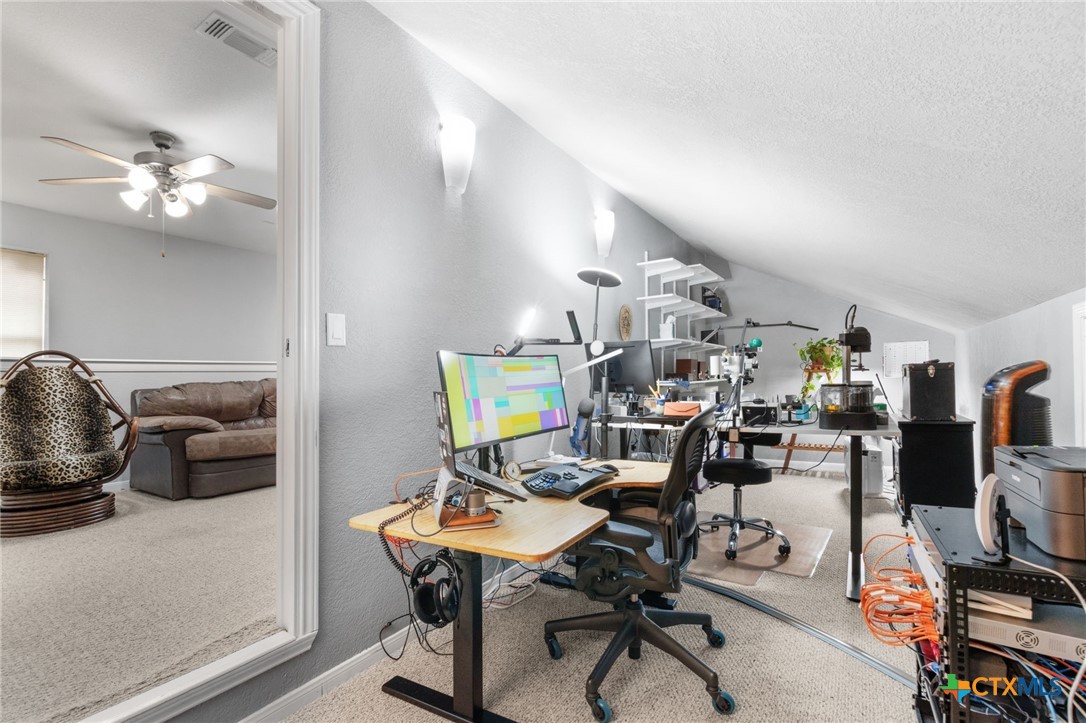 812 Taylor Creek Road Copperas Cove, TX 76522 - Photo 30 of 44 a view of a workspace with furniture and a livingroom