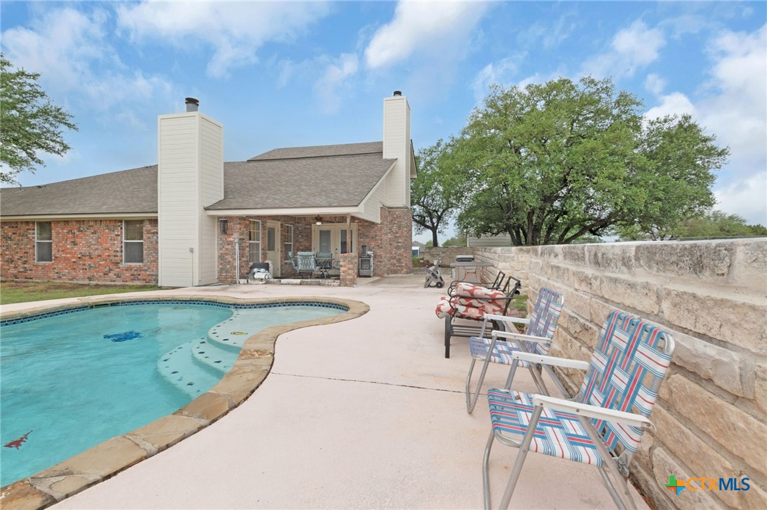 812 Taylor Creek Road Copperas Cove, TX 76522 - Photo 35 of 44 a view of a patio with a table and chairs and potted plants