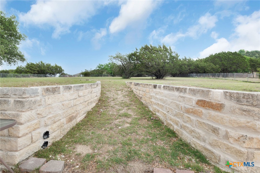 812 Taylor Creek Road Copperas Cove, TX 76522 - Photo 38 of 44 a view of swimming pool with lake and trees in the background
