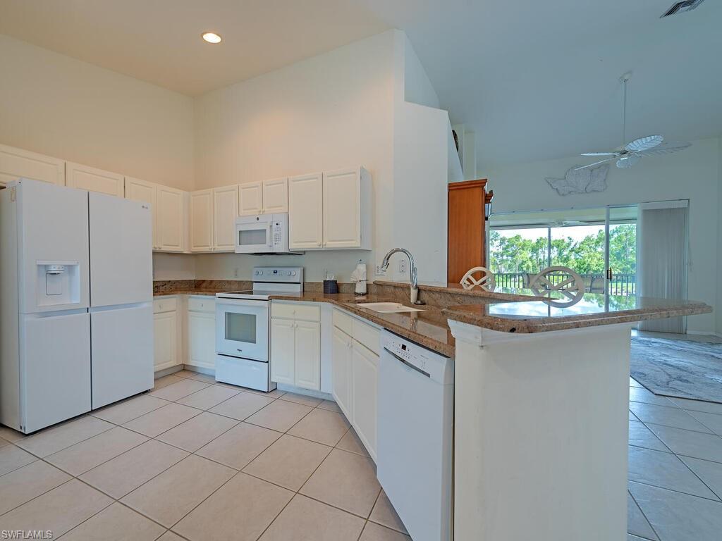 9351 Spring Run Boulevard, Unit 3203 Estero, FL 34135 - Photo 4 of 14 Kitchen - open to the great room