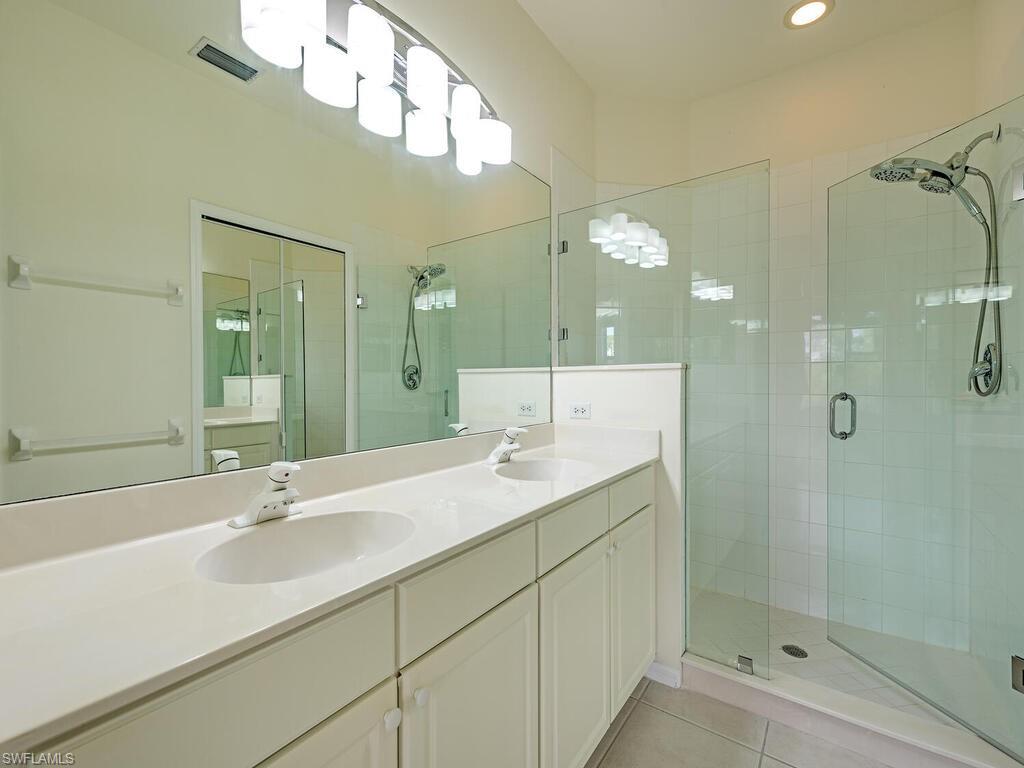 9351 Spring Run Boulevard, Unit 3203 Estero, FL 34135 - Photo 10 of 14 Primary bedroom En-suite