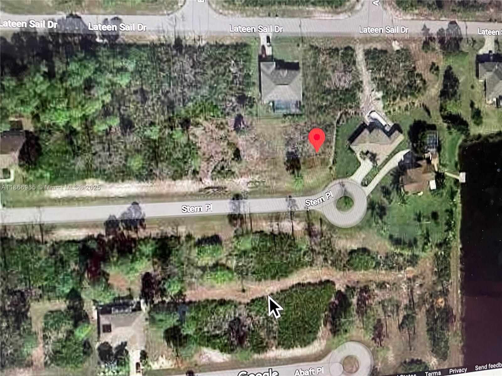 14 Stern Place Placida, FL 33946 - Photo 2 of 4 an aerial view of a house with a yard and potted plants