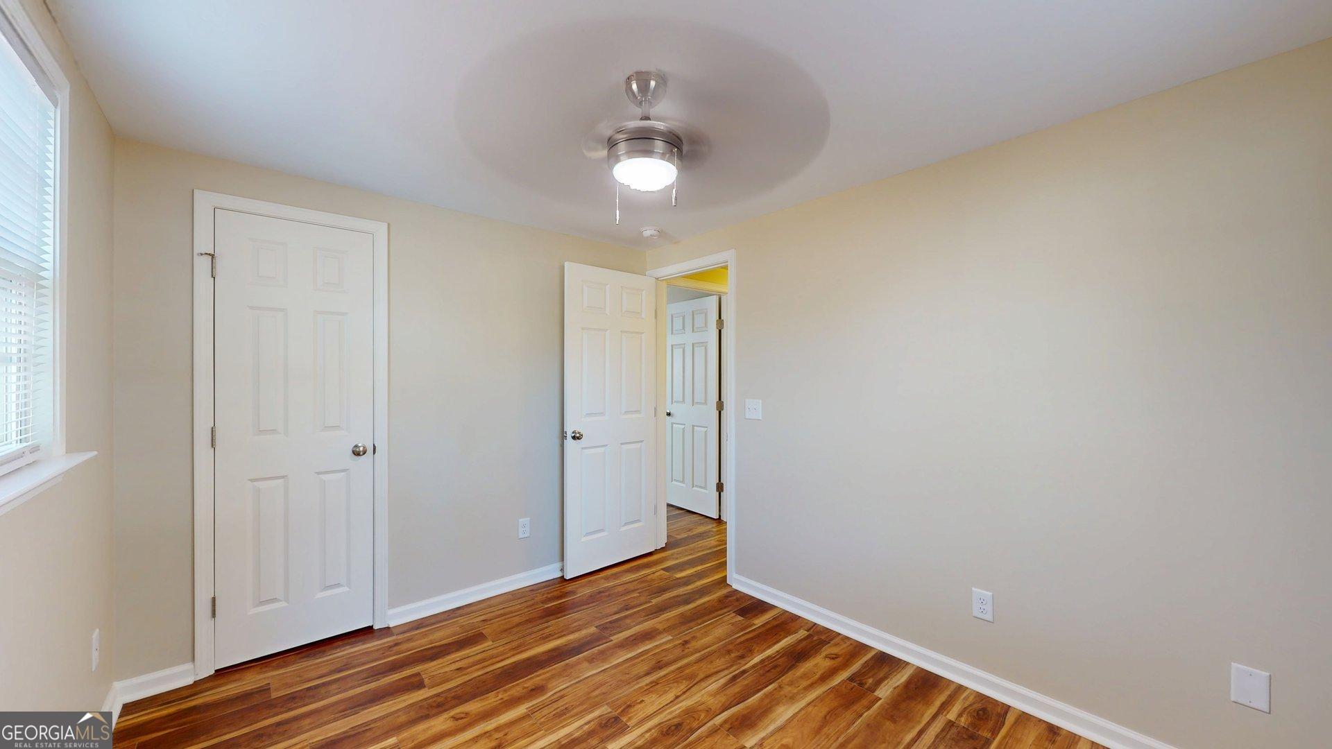 142 Bill Brown Road Pembroke, GA 31321 - Photo 19 of 33 a view of an empty room with wooden floor