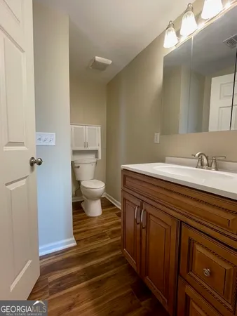 a bathroom with a sink and mirror