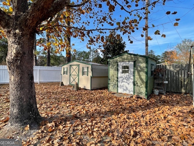 142 Bill Brown Road Pembroke, GA 31321 - Photo 25 of 33 a front view of a house with a tree