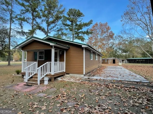 a backyard of a house with lots of green space