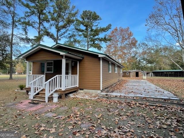 142 Bill Brown Road Pembroke, GA 31321 - Photo 3 of 33 a backyard of a house with lots of green space