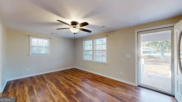 a view of a kitchen with a sink and a kitchen view