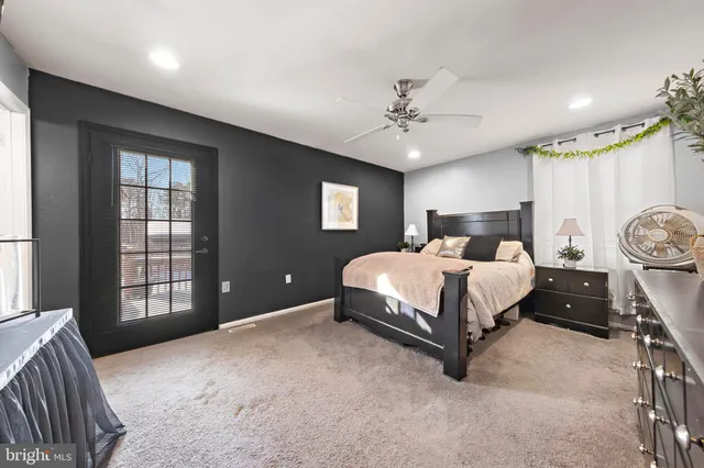 a bed room with a bed and a window