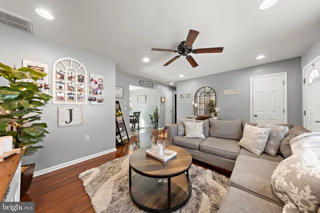 a living room with furniture and a rug