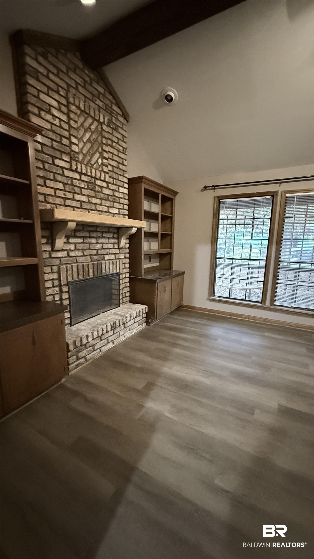 4131 Springdale Road Mobile, AL 36609 - Photo 2 of 28 Unfurnished living room with a brick fireplace, dark wood-style floors, and recessed lighting