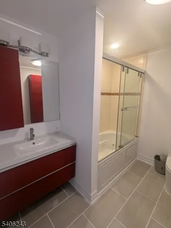 a bathroom with a double vanity sink and mirror