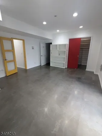 an empty room with furniture and window